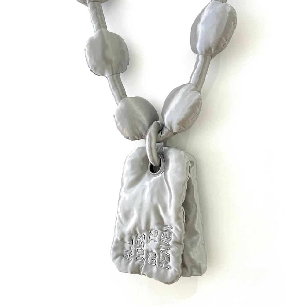 Giant textile chain with dog tags that say ALL DOGS GO TO HEAVEN