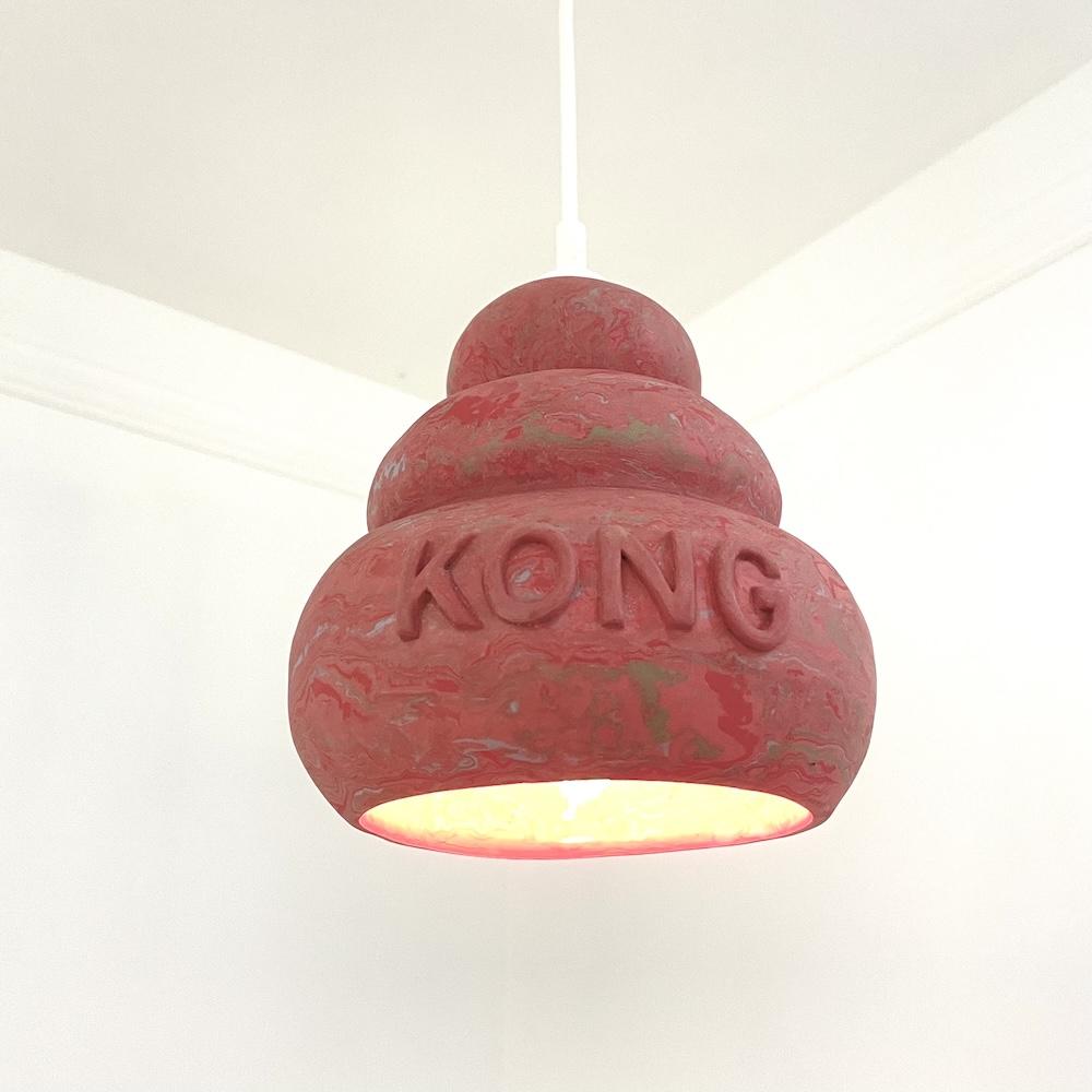 Multicolored marbled hanging ceramic lampshade in the shape of a dog toy