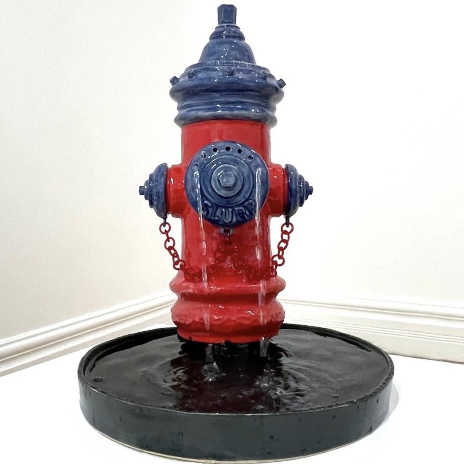 Ceramic fire hydrant sculpture with streams of water